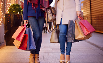 women walking with shopping bags